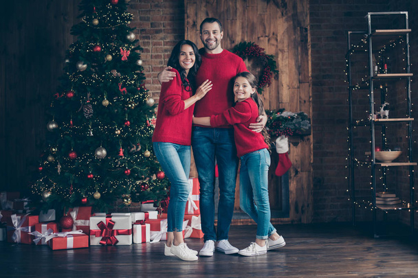 Full length body size view of three nice attractive lovely affectionate glad cheerful cheery family mommy daddy enjoying tradition in decorated industrial loft wood brick style interior indoors - Photo, image