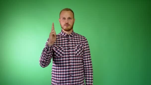 Sad bearded young man. Plaid shirt. Hand like a gun. Suicide concept. Head shot. - Footage, Video