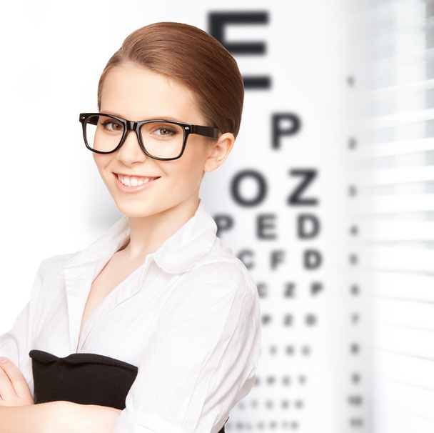 Woman in eyeglasses with eye chart - Fotoğraf, Görsel