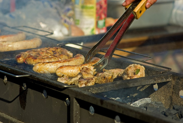 Sausages and meat on the grill - Photo, Image