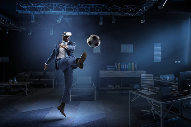 Black Man and Virtual Reality Soccer Match - Photo, image