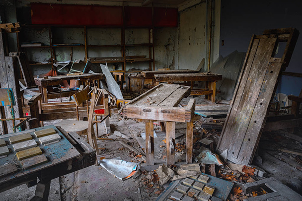 Messy and abandoned classroom in ghost town - Photo, image