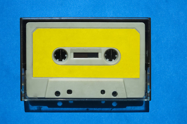 Retro gray cassette tape in transparent box - Фото, зображення