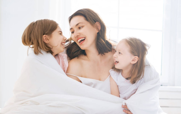girls and their mother enjoy sunny morning - Photo, Image