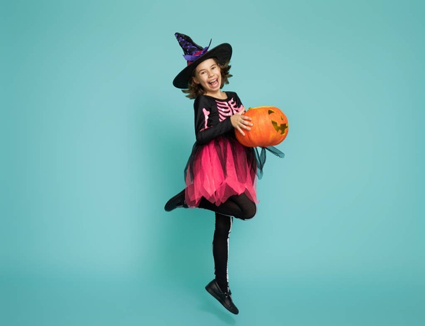 little witch on turquoise background - Foto, Bild