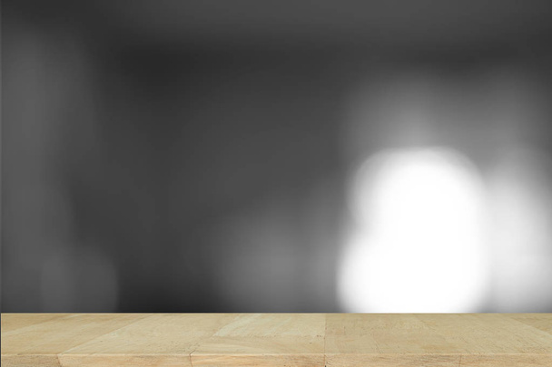 Dřevěný stůl s šedým gradientem rozmazané abstraktní pozadí. - Fotografie, Obrázek