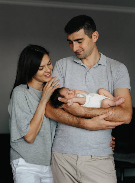 Happy family with newborn baby. Beautiful morther and happy father - Photo, Image