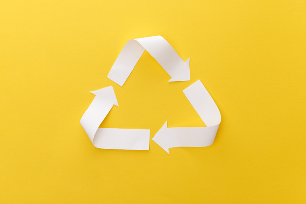 top view of paper craft triangle on yellow background - Photo, Image