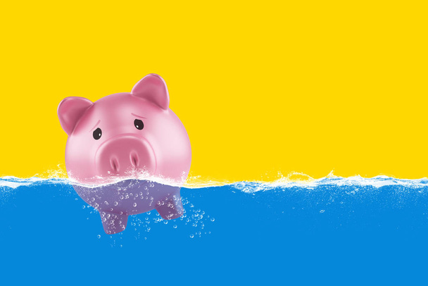 Lonely piggy bank sails in bad waters due to the crisis - Photo, Image