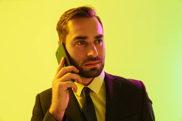 Handsome young businessman wearing formal suit - Fotó, kép