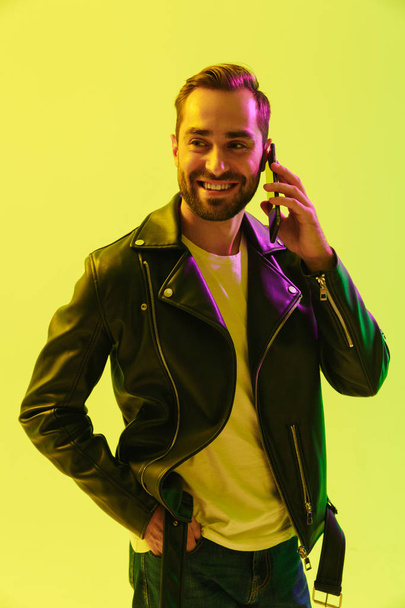 Attractive young man wearing leather jacket - Φωτογραφία, εικόνα