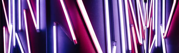 Neon lights. Light colorful blue and red neon lights over dark b - Фото, изображение