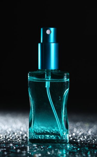 Women perfume in beautiful bottle on dark background - Фото, зображення