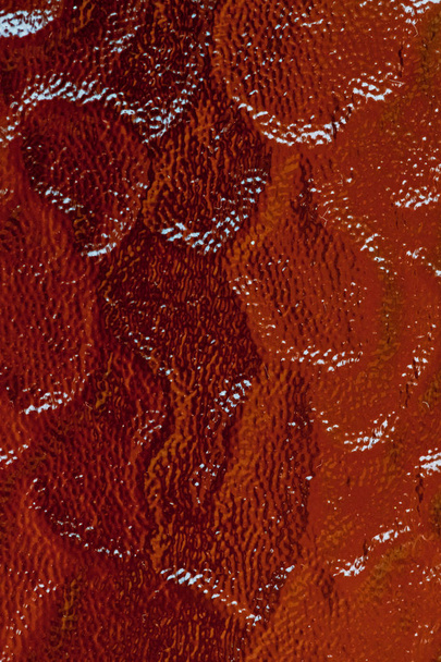 Рельєфна текстура скла в червоному і помаранчевому кольорах
 - Фото, зображення