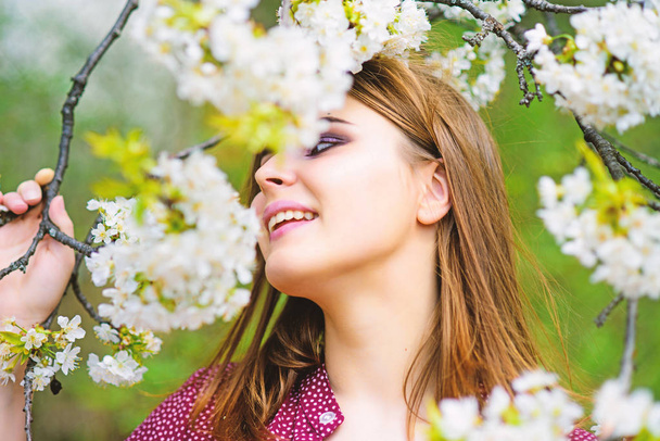 Spring mood. pretty woman skincare. girl like nature. natural beauty makeup. hair fashion. fashion beauty. sexy woman in spring blossom. summer blooming trees and flowers. cherry flower - Foto, afbeelding
