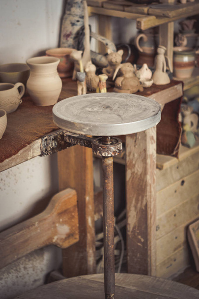 Pottery studio, empty potters wheel, pottery from clay - Photo, Image