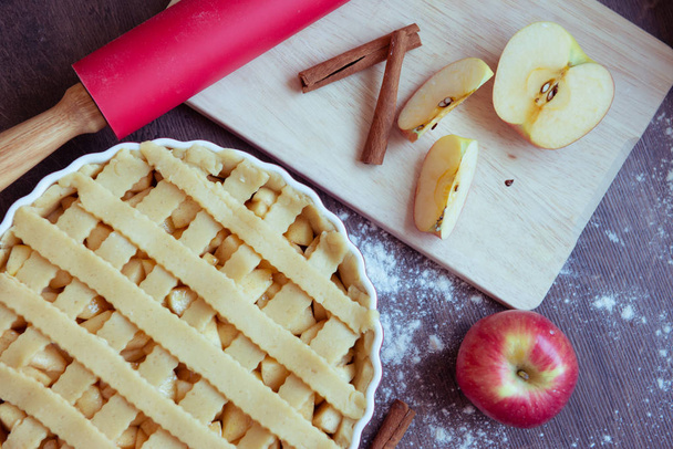 Traditional homemade apple pie and ingredients on wooden backgro - Foto, immagini
