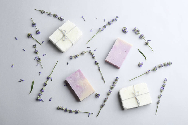 Hand made soap bars with lavender flowers on white background, top view - Photo, image