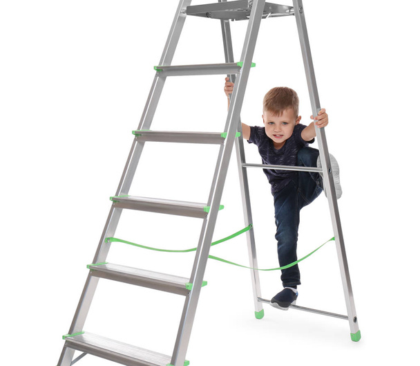 Little child climbing up ladder on white background. Danger at home - Фото, зображення
