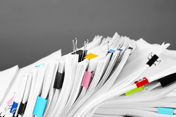 Pile of documents with colorful binder clips, closeup - Valokuva, kuva