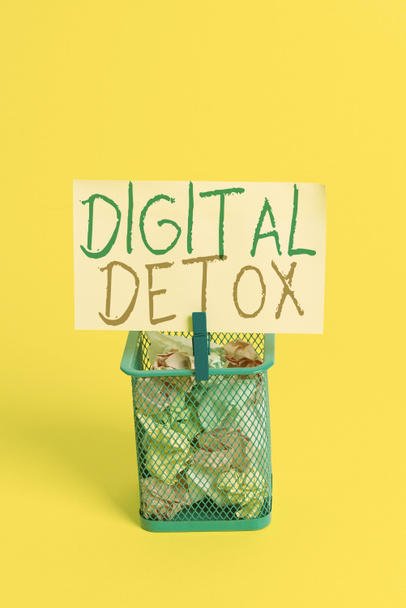Handwriting text Digital Detox. Concept meaning Free of Electronic Devices Disconnect to Reconnect Unplugged Trash bin crumpled paper clothespin empty reminder office supplies yellow. - Photo, Image