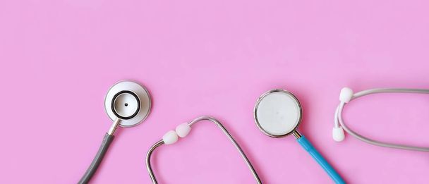 close up of stethoscope on pink  background      - 写真・画像