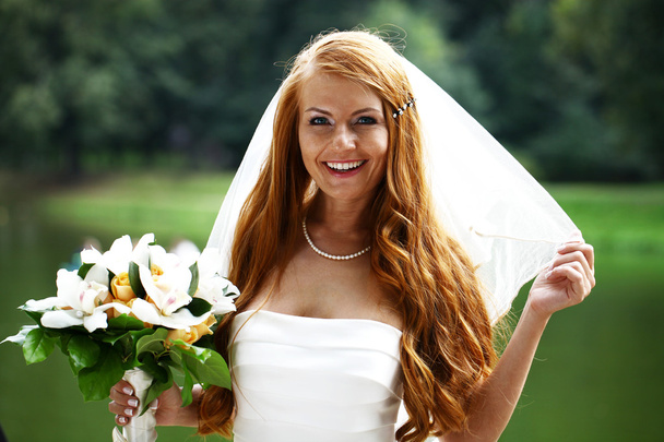 Beautiful red hair bride wearing wedding dress - Foto, imagen