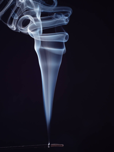 White smoke from burning incense isolated on black background, close up view. Abstract background, smoke brush. Eastern sweet smell for meditation. Fragrance for relaxation. - Foto, Imagem