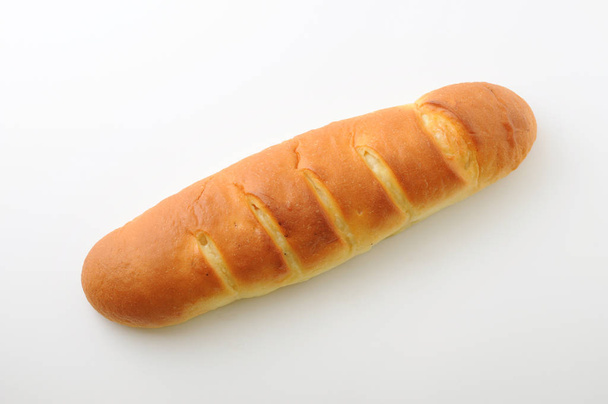 beyaz arka plan üzerinde izole uzun tereyağı ekmek closeup - Fotoğraf, Görsel
