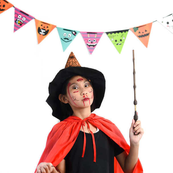 Asian girl with witch costume, halloween concept. - Zdjęcie, obraz