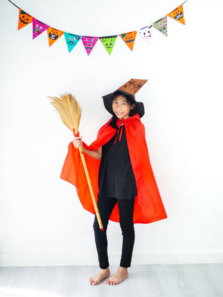 Asian girl with witch costume, halloween concept. - 写真・画像