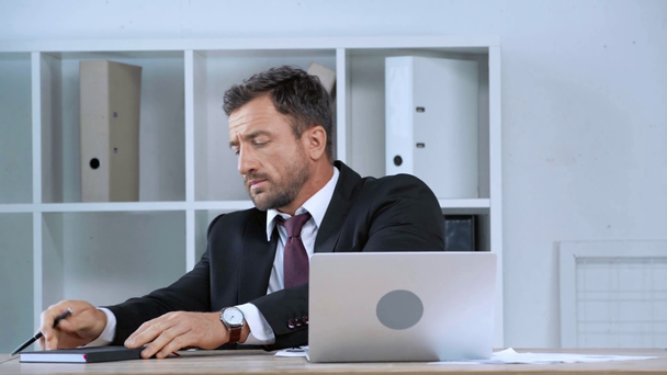 mature businessman opening laptop and starting to work in office - Footage, Video