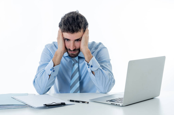 Desperate caucasian entrepreneur businessman feeling tired and overworked in pain with headache or migraine at desk in People, Stress, Technology and Overtime concept isolated in white background. - Φωτογραφία, εικόνα