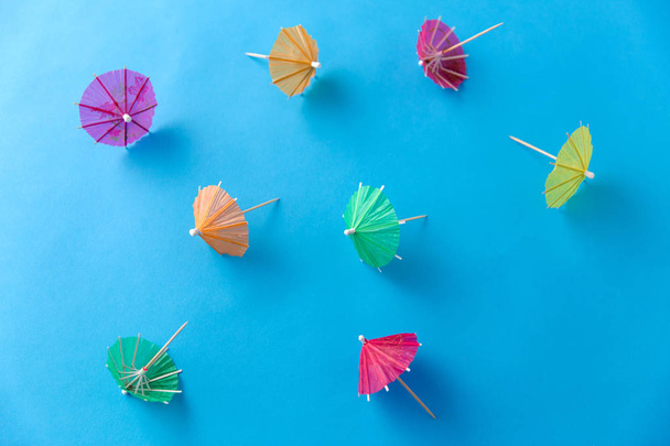 cocktail umbrellas on blue background - Photo, Image