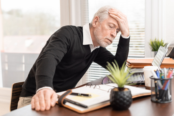 Portrait of overworked senior businessman - Photo, Image