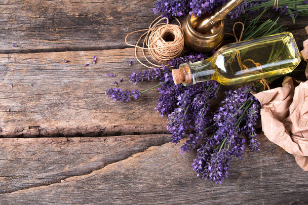 spa massage setting, lavender product, oil on wooden background, Vlaentine day background - Fotó, kép