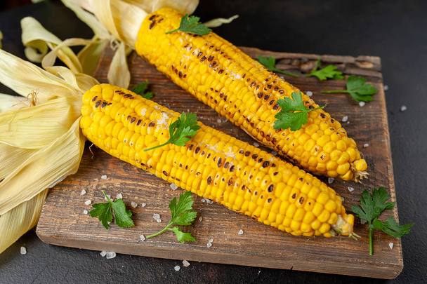 fresh organic corn on a wooden background - Photo, Image