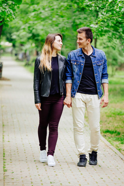 Young couple walking in park - Fotó, kép
