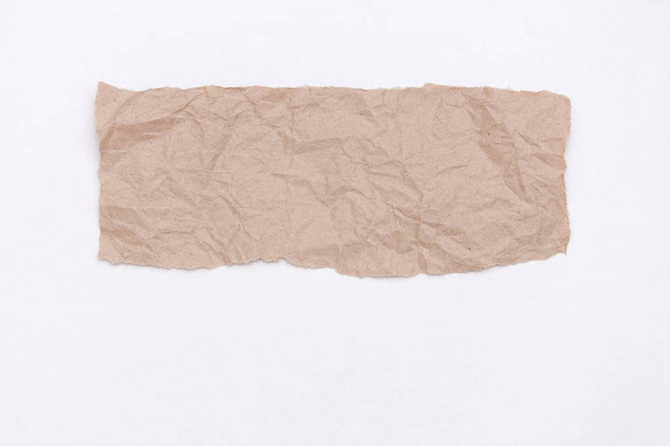 Abstract part of packaging craft wrinkled paper on white background. - Photo, Image
