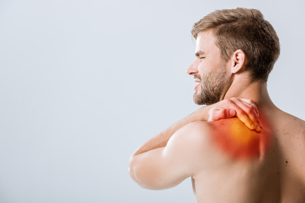 shirtless bearded man with pain in shoulder isolated on grey - Fotoğraf, Görsel