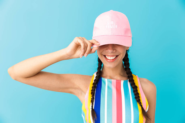 Image of stylish brunette girl wearing summer dress and cap smil - Foto, afbeelding