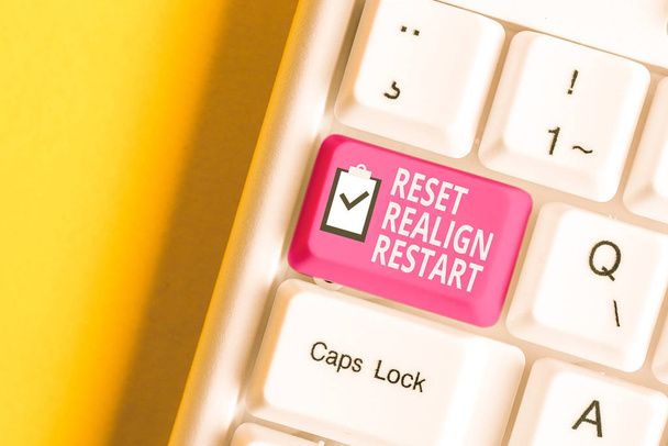 Handwriting text writing Reset Realign Restart. Concept meaning Life audit will help you put things in perspectives White pc keyboard with empty note paper above white background key copy space. - Photo, Image