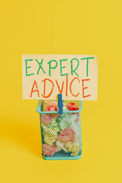 Handwriting text Expert Advice. Concept meaning Sage Good Word Professional opinion Extensive skill Ace Trash bin crumpled paper clothespin empty reminder office supplies yellow. - Photo, Image