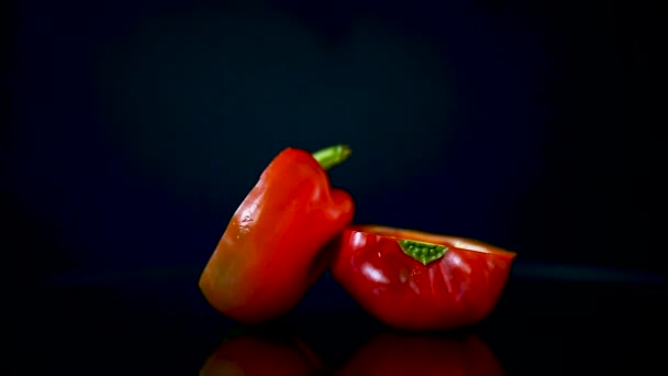 Red Paprika isolated on black - Materiaali, video
