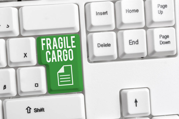 Conceptual hand writing showing Fragile Cargo. Business photo showcasing Breakable Handle with Care Bubble Wrap Glass Hazardous Goods White pc keyboard with note paper above the white background. - Photo, Image