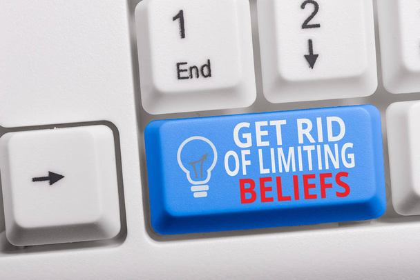 Writing note showing Get Rid Of Limiting Beliefs. Business photo showcasing remove negative beliefs and think positively Keyboard with note paper on white background key copy space. - Photo, Image