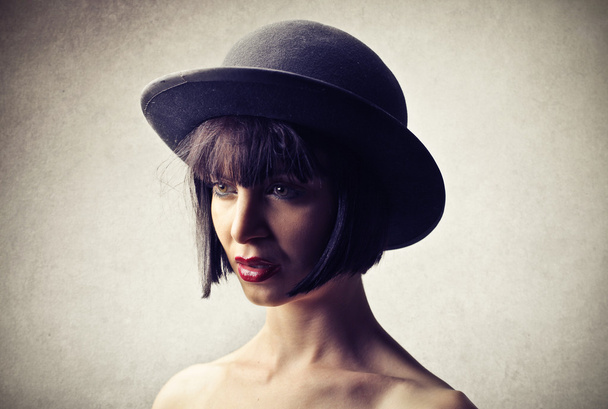 Young woman wearing a hat - Fotó, kép