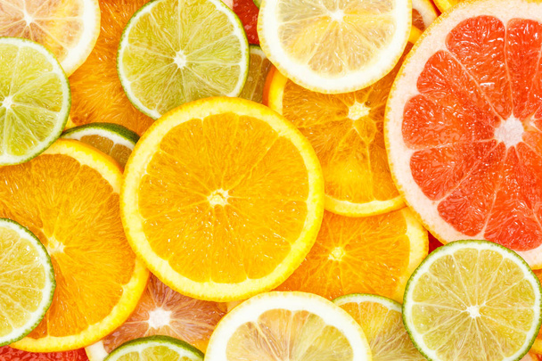 Citrus fruits collection food background oranges lemons limes gr - Fotó, kép