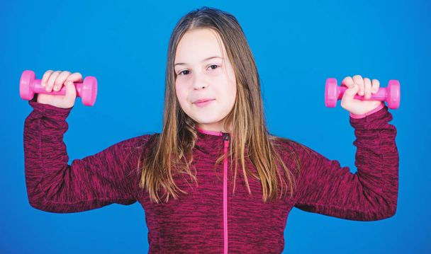 Deep squat. Happy child sportsman with barbell. workout of small girl hold dumbbell. weight lifting for muscules. Childhood activity. Fitness diet for energy health. Sport success. One more squat - Fotografie, Obrázek