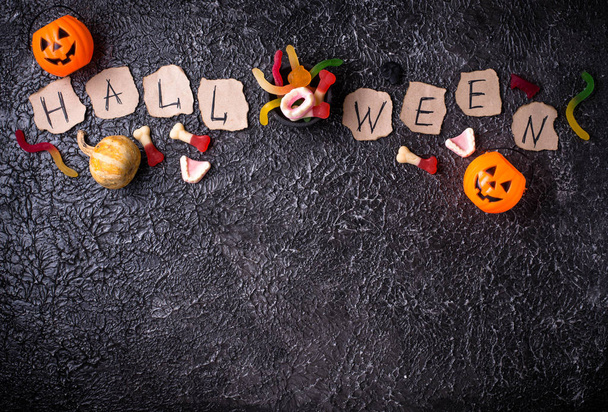Creative Halloween background with treats - Photo, Image